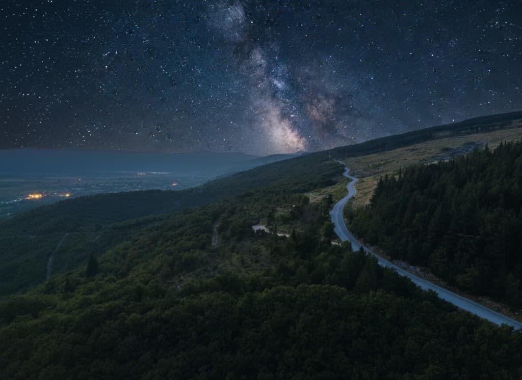 Scenic road through nature at night